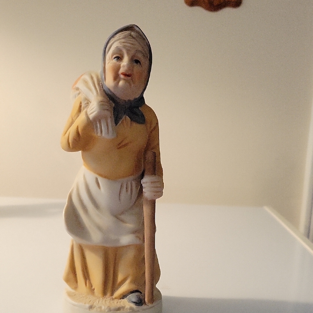 Charming Vintage-Style Figurine in Yellow and Cream